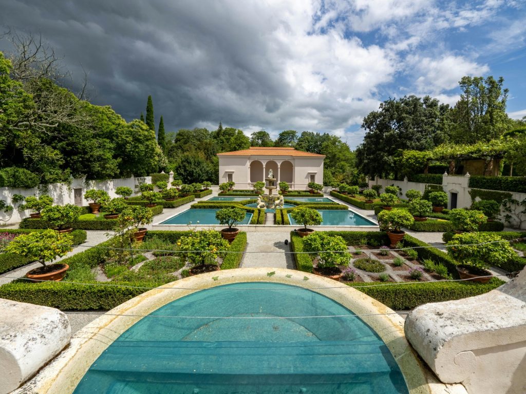 Formal garden with a building and reflecting pools